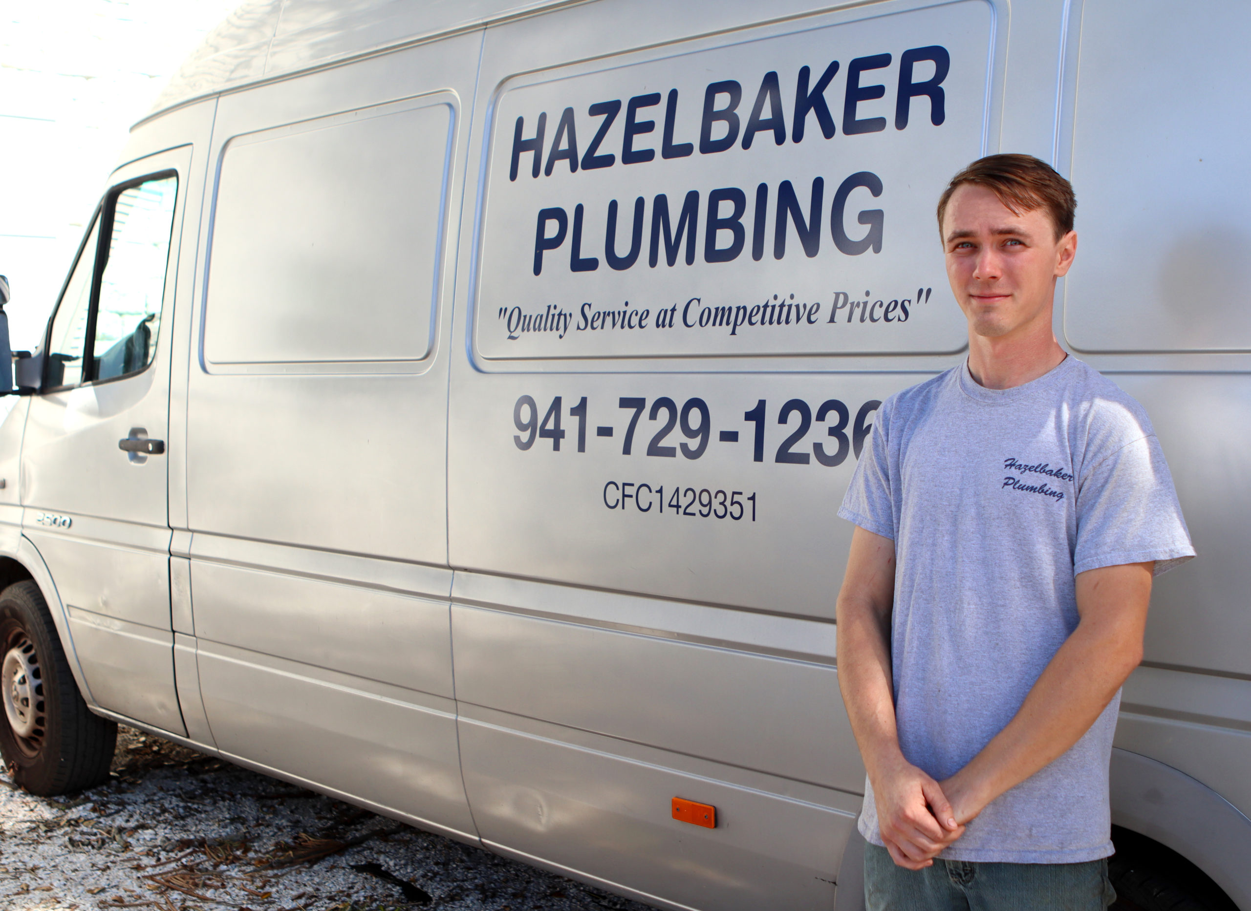 Cody Hazelbaker infront of Hazelbaker Plumbing Van